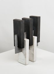 Three black and two white rectangles, shifted vertically, fixed in the centre with a silver board